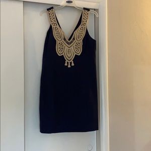 A navy and gold Lily shift dress.